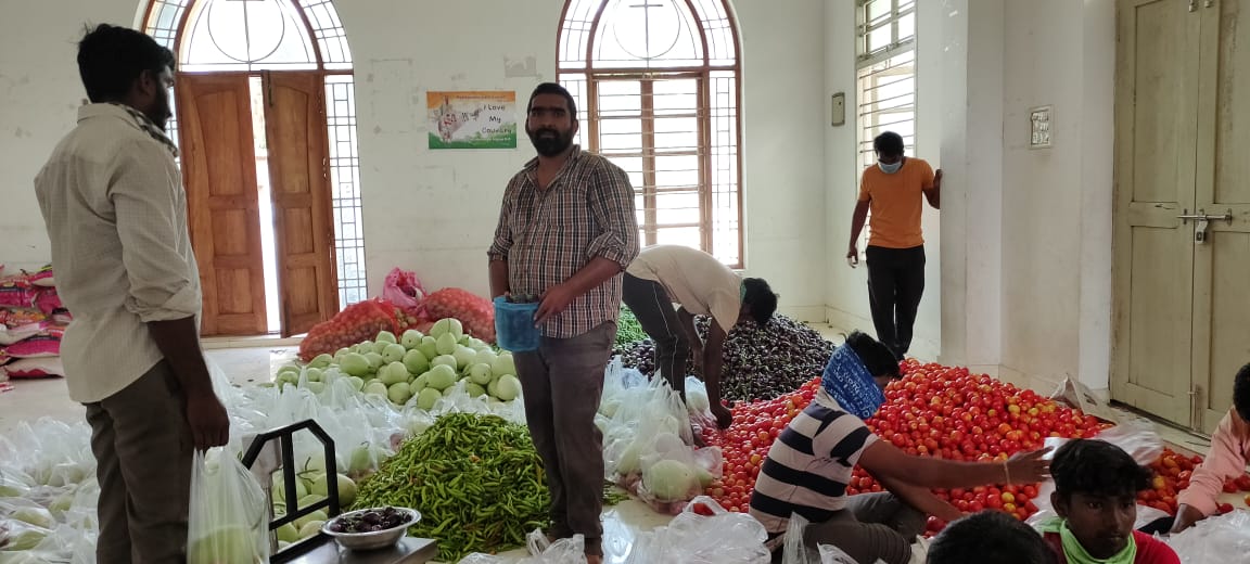 Plenty to Share Ministry prepare food parcels to help the poorest families. DT helped provide financial support.