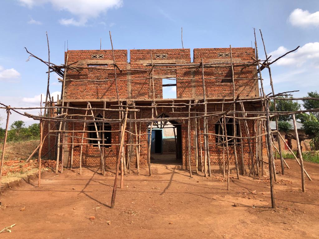 Kibare parish visit - new church building constructed around old church building