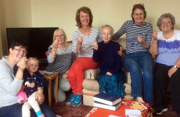 Lunch & Learn group in Pocklington holding matches as a reminder to pray for prisoners in Romania who have been on our mentoring programme.