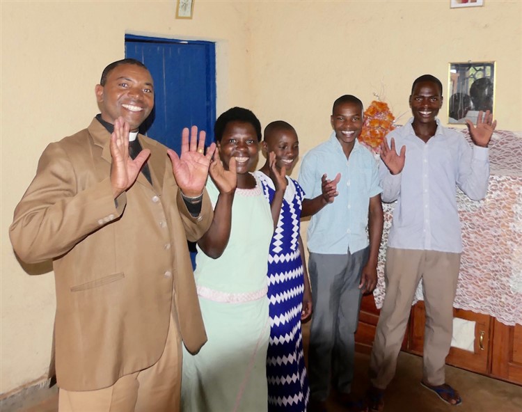 Pastor Damascene, his wife and family at Rutunga parish in the diocese of Gasabo.