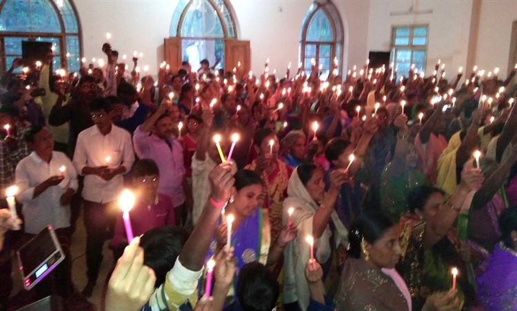 Candle-lit celebration as Christmas day dawn breaks